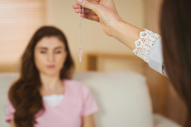 A therapist conducting hypnosis on a patient