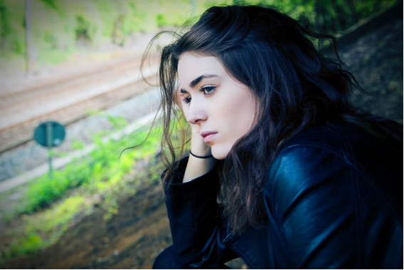 An anxious woman with her hand on her head