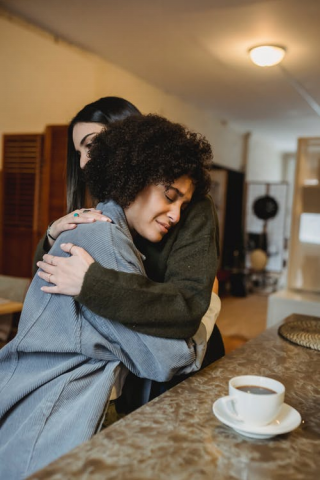 A woman hugging her friend