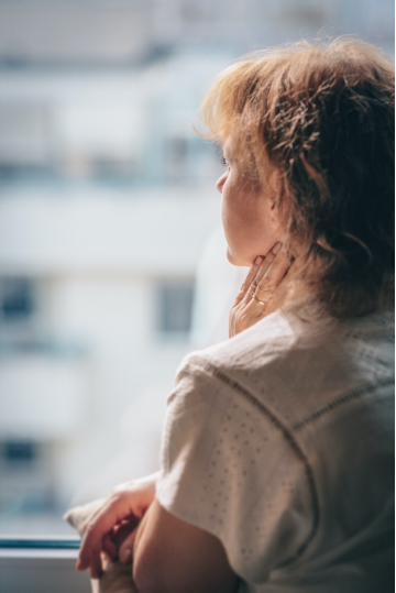 a woman looking out the window