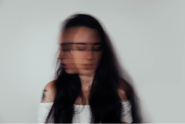 A blurry image of a woman