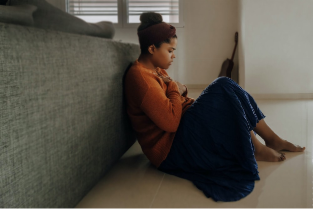 a woman sitting on the ground