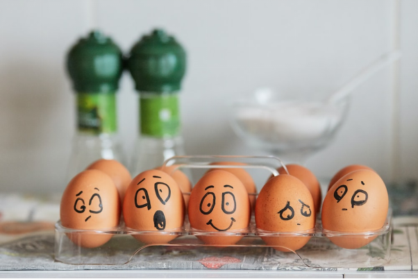 A tray of eggs with markings on them