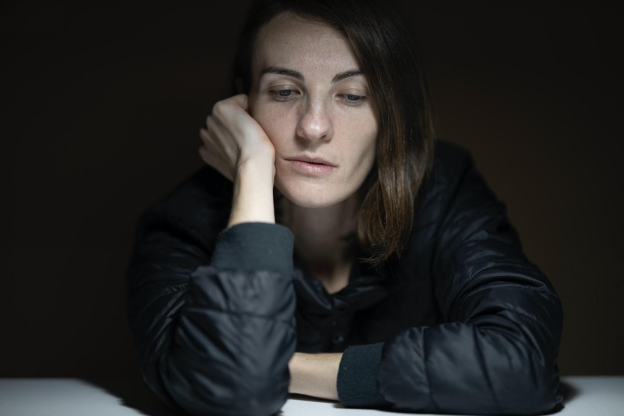 Depressed Woman in a Black Jacket