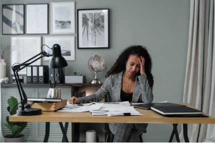 A person looking stressed at work